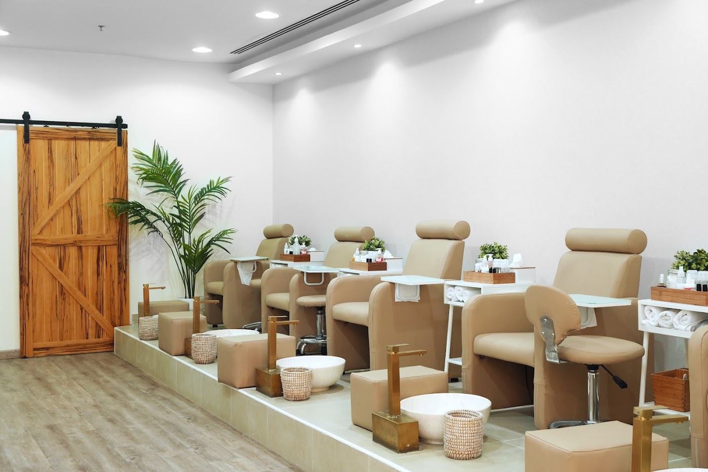 Sky Beauty Salon pedicure lounge with cream chairs and wood accents