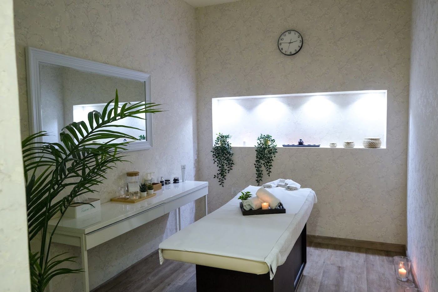 Quiet treatment room with candlelit niche